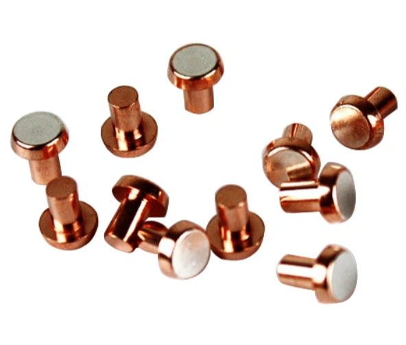 Several tungsten-copper electrical contacts on a white background