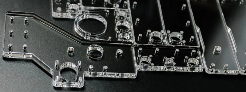 A close-up view of enclosure parts for industrial equipment; there are a lot of holes and fitting elements on the surface