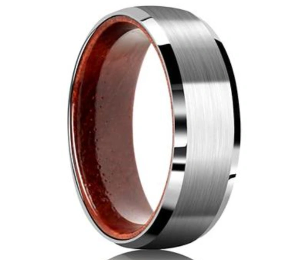 A shiny grey ring with a chamfered outer surface and brown inner surface