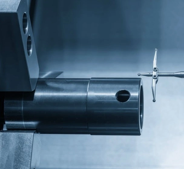 An image showing a measurement probe taking dimensions of a hollow shaft held in a lathe