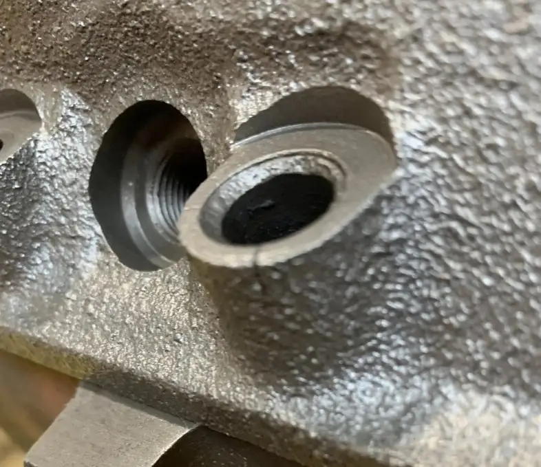 An image showing two spotface holes machined at different angles on an irregular surface