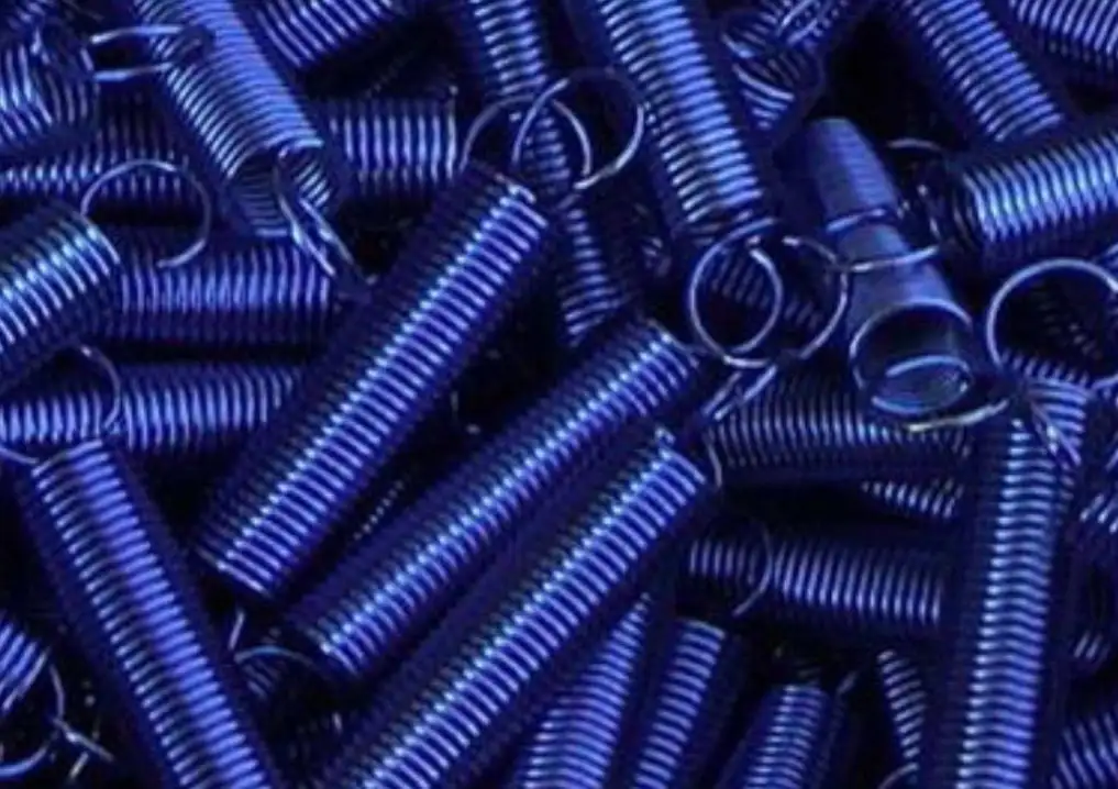 A heap of blue zinc-plated springs