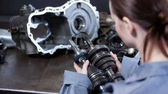 Image of precision automotive components, including shaft gears and engine parts