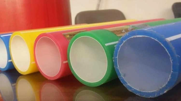 An image of coloured HDPE tubes arranged in a row. It showcases the variety of available colours and the smooth surface finish of the tubes