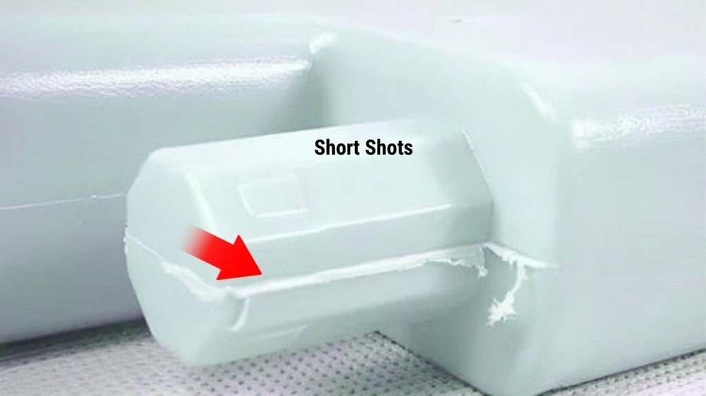 An image showing flash formation in a molded part. It highlights excess material along the edges