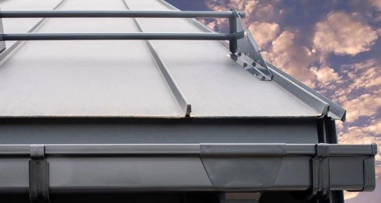 An image of a sheet metal roofing and gutter system showing different types of hemming