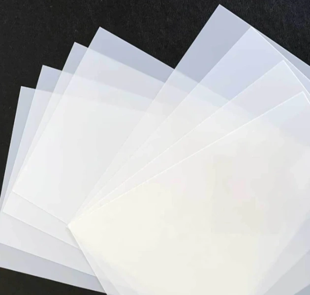 An image of a pile of white sheets of mylar