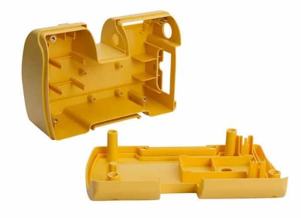 Two yellow-colored nylon parts with fitting elements for assembly are made with injection molding