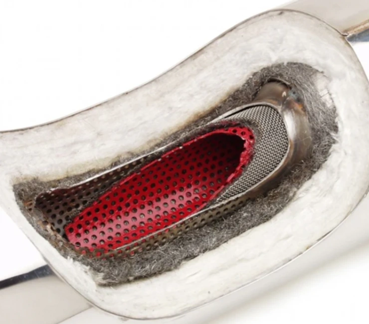 A cutaway view of a muffler showing internal components, including a red perforated tube