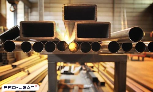 A shot of steel pipes placed on a table in a workshop