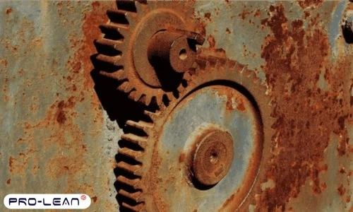 A close-up of old, rusted silver machine parts