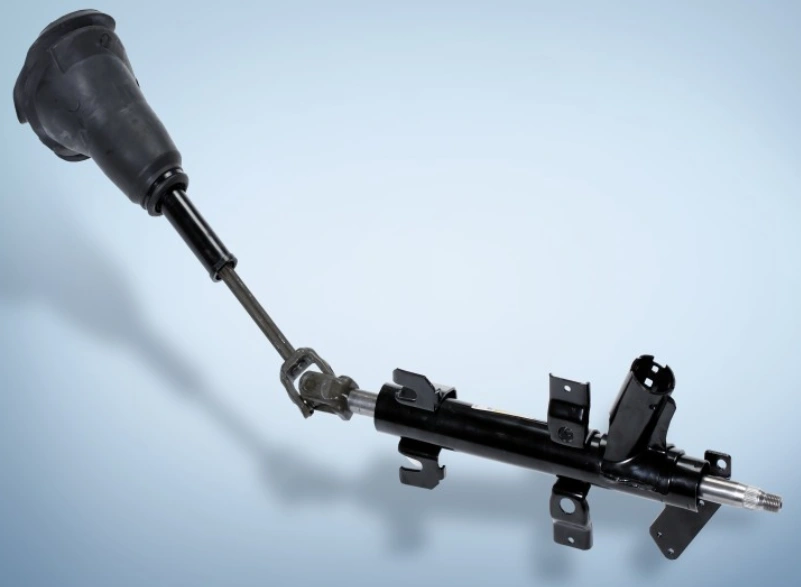 An image of two shafts connected by a joint with a steering column on one end