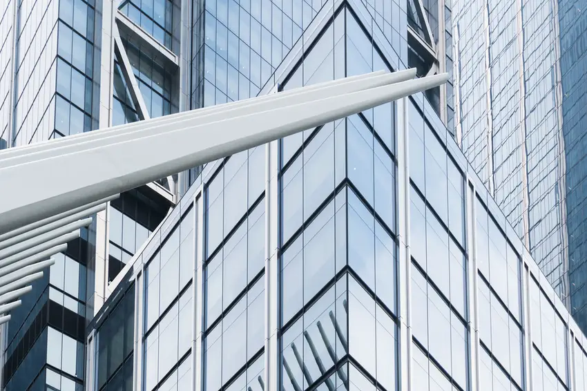 An image of a storey building facade with stainless steel features