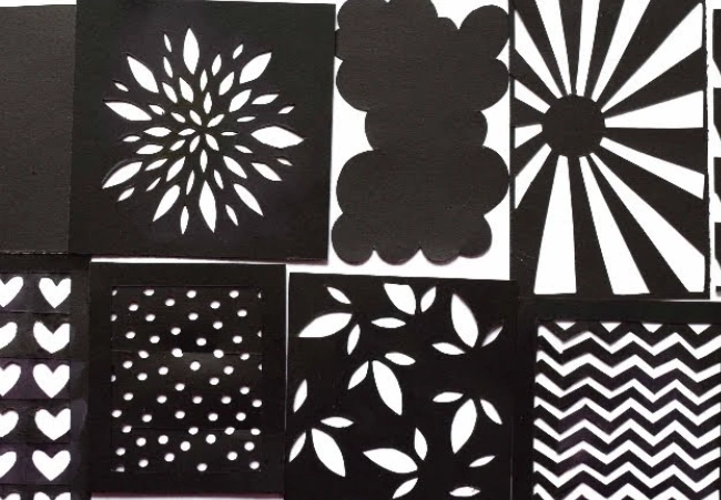 An image showing a set of hand-made stencils of different designs