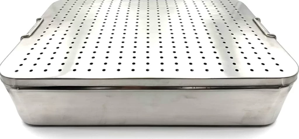 An image of a stainless steel sterilization tray with accurately machined holes on the cover