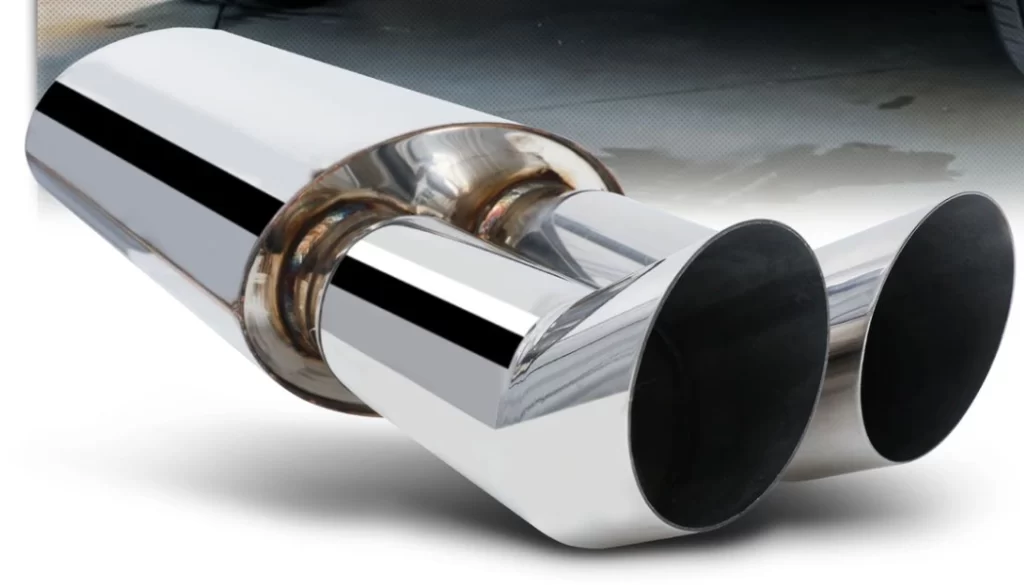 A stainless steel muffler with dual polished exhaust tips and a shiny chrome-like finish