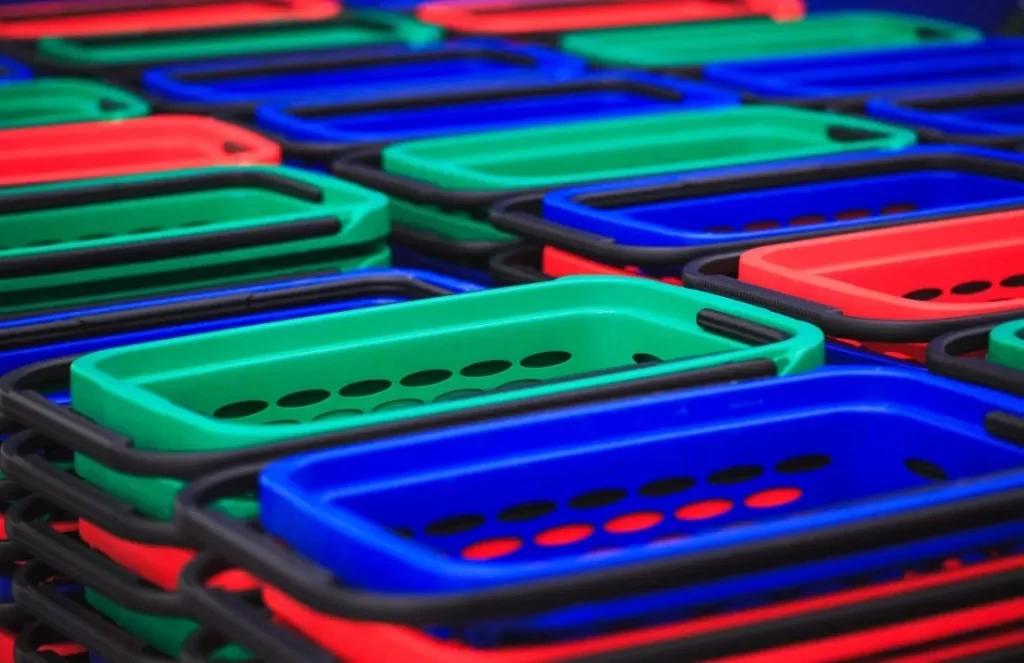 An image of many ABS plastic shopping baskets arranged in rows