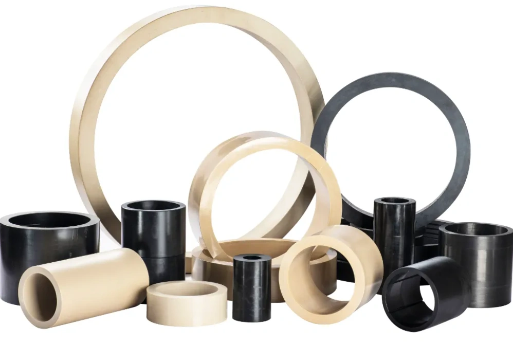 An image of black and grey PEEK tubes and rings 