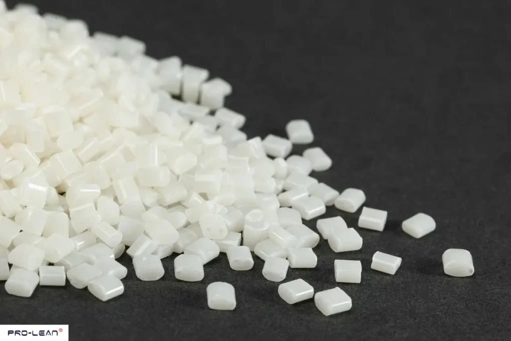 Close-up of many small, white ABS plastic pellets.