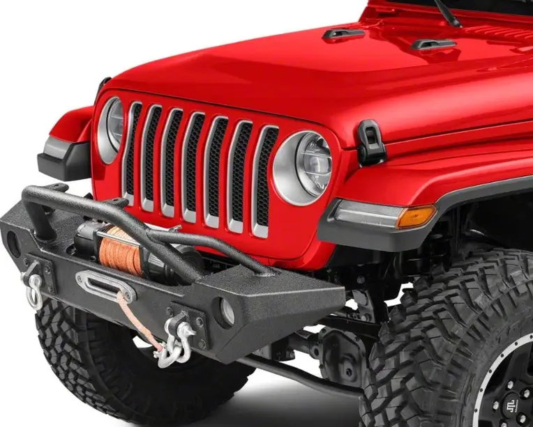 An image of a matte black aluminum front bumper on a red offroad car