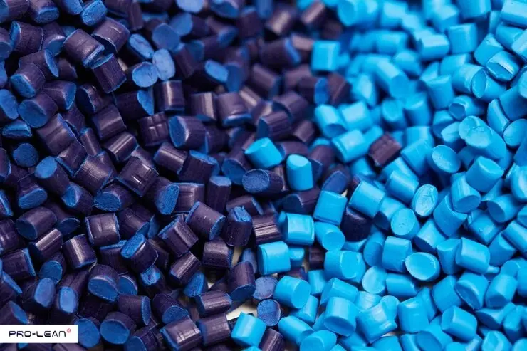 Blue and purple polypropylene pellets are used in manufacturing.