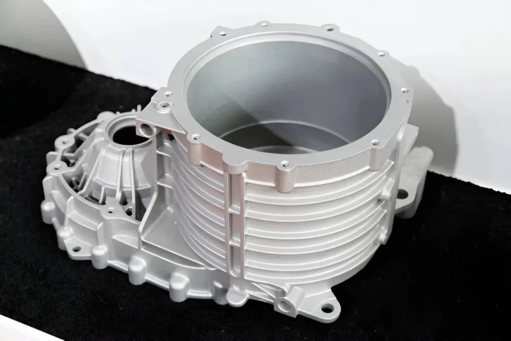 Close-up view of an automotive engine cover made of cast aluminum.