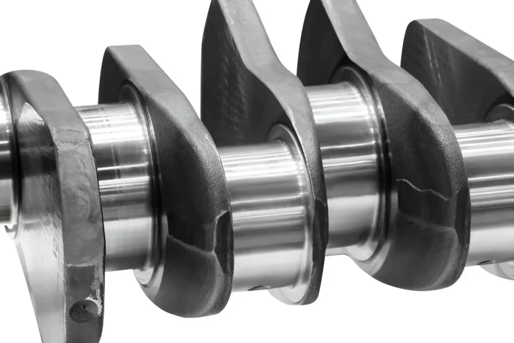Crankshaft featuring cast iron metal layering shown in close-up.