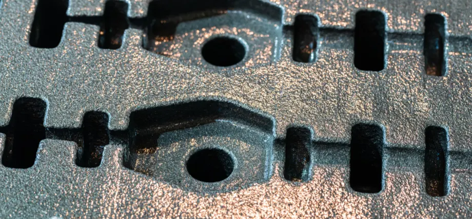 Metal mold with slots and cavities