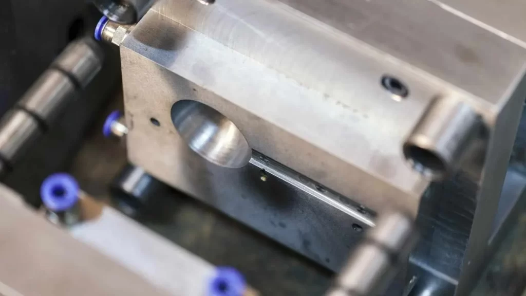 The image shows a close-up of a resilient hard tooling mold. It highlights its sturdy and durable design.