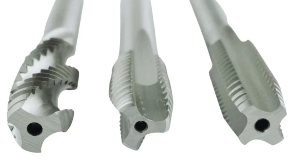 A close-up view of machine taps with different flute designs. 
