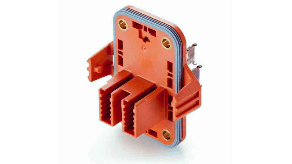 Close-up image of a plastic part with a rubber seal overmolded onto it. The rubber forms a tight seal around the plastic surface.