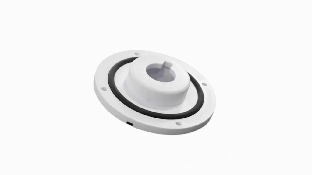 Close-up showcase of a rounded overmolded part in a white and black color combination.