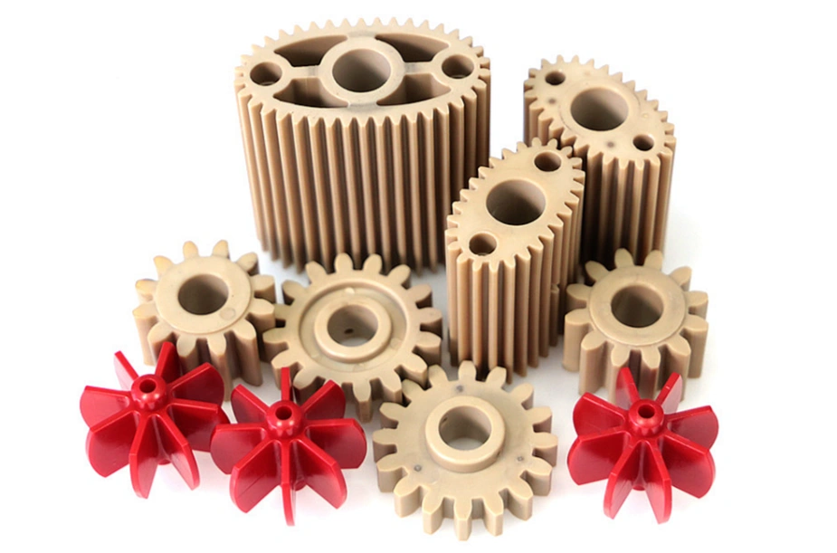 Several designs and sizes of red and grey PPS plastic gears