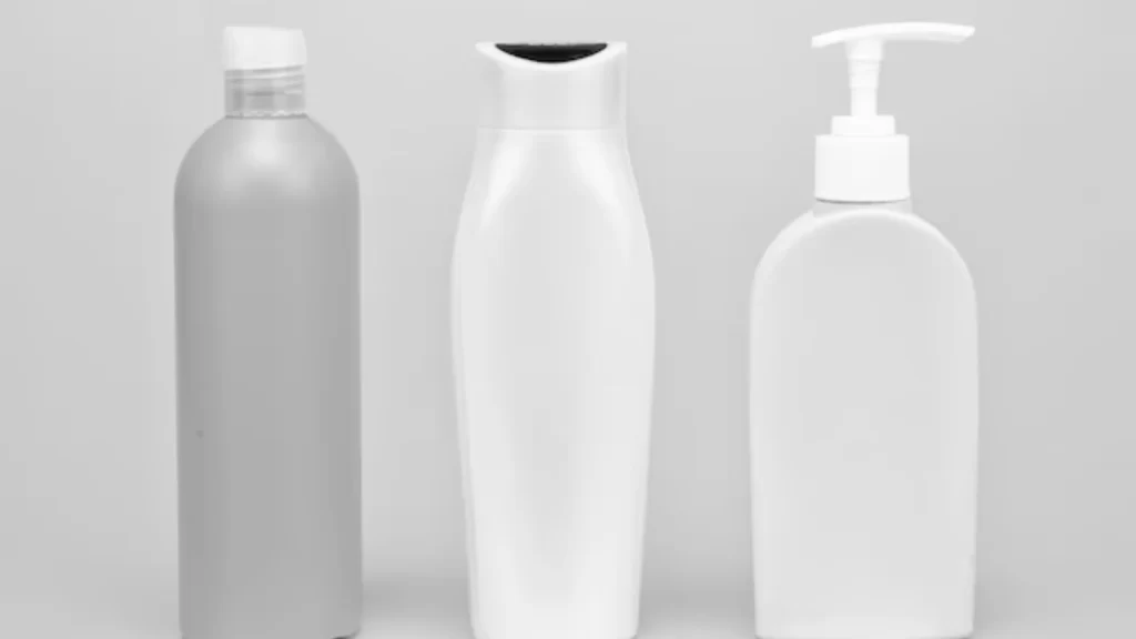 The image shows hand wash and shampoo bottles made with two-shot molding.
