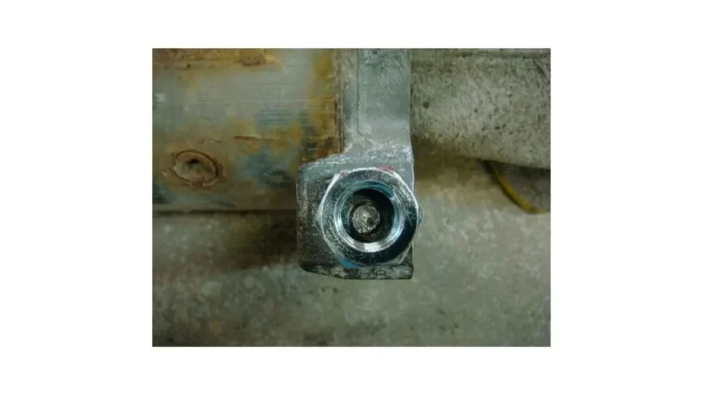 An image showing a nut being welded onto a broken stud to aid in its removal. 