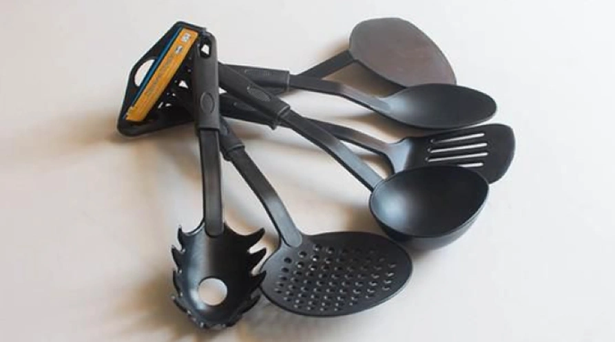Different designs of black heat-resistant plastic (polyamide) cookware