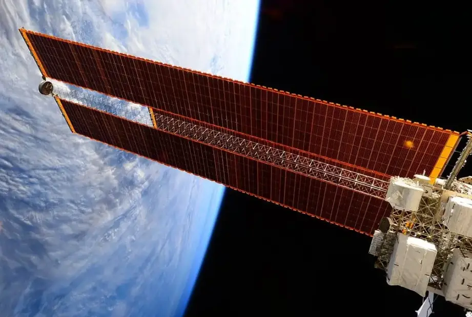 Sizeable solar arrays for a space station with the space in the background 