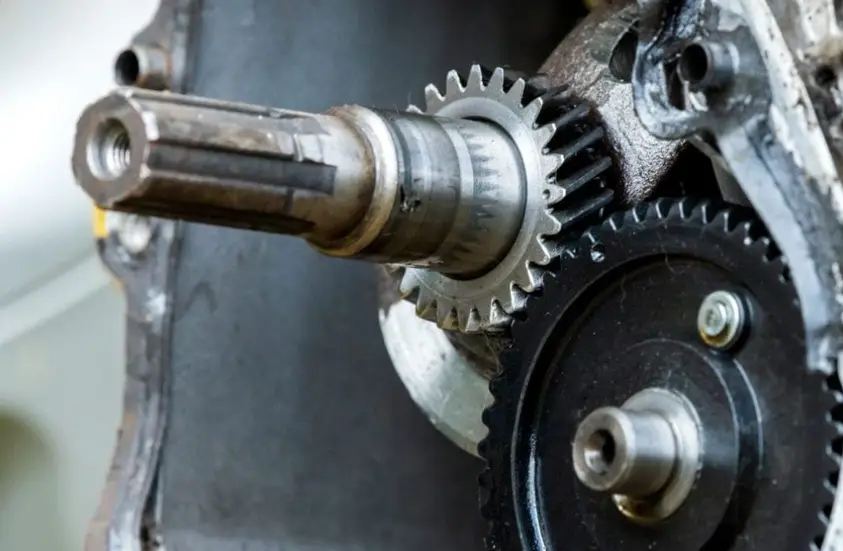 A close-up image of a spline shaft and gear assembly for torque transfer in automotive systems