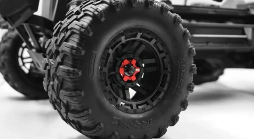 A closeup of black aluminum 7075 rims for off-road vehicle