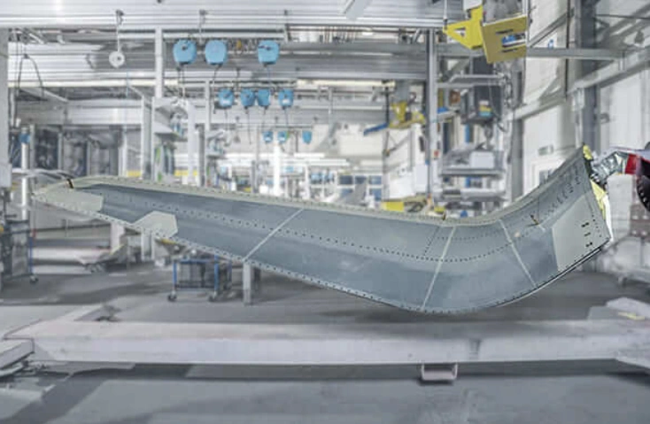 An image of an aircraft wing in a factory 