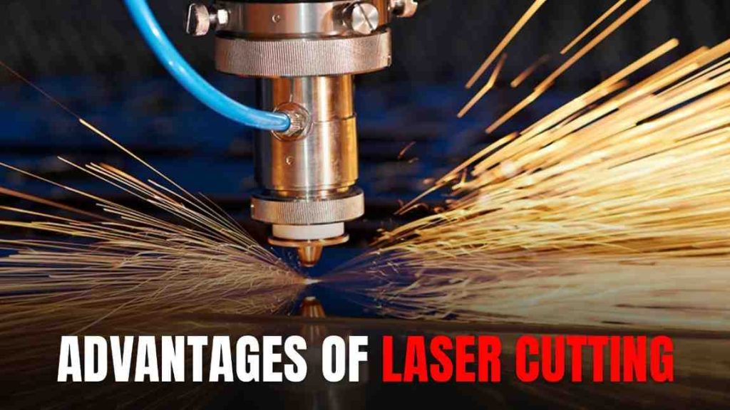 Laser head cutting metal, producing a shower of bright orange sparks.