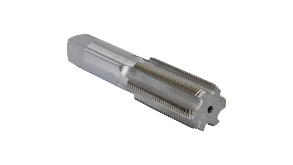 A close-up of a silver metal tap tool with a flat end, designed for threading.