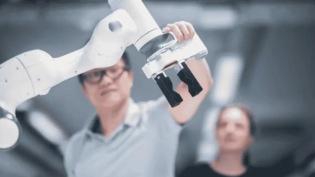 The image shows a collaborative robot. This robot is designed to work safely alongside humans.