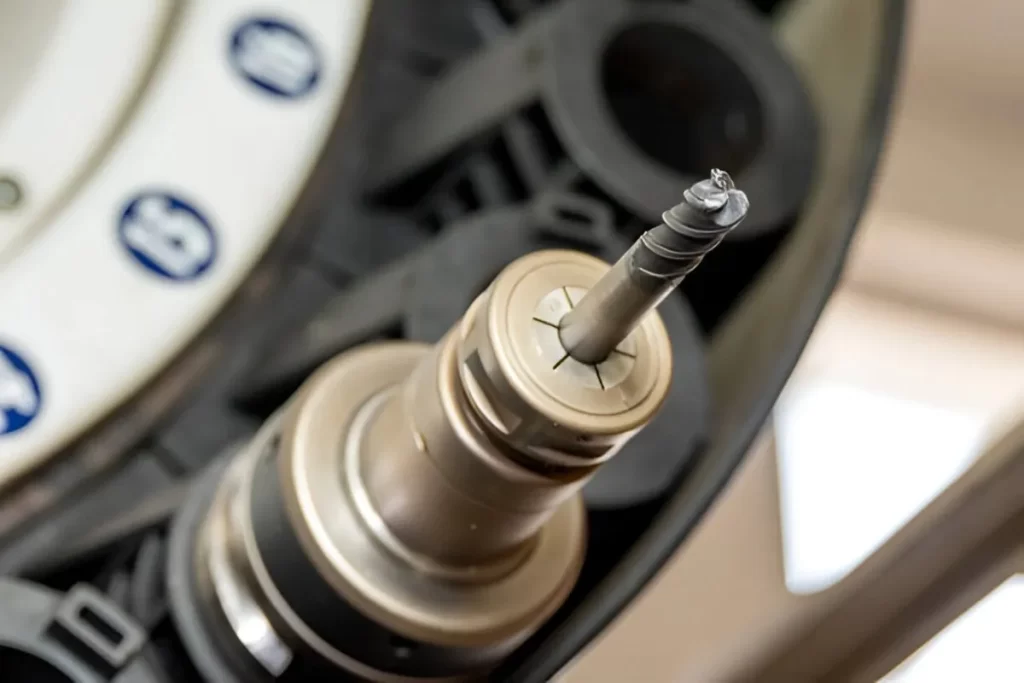 Close-up view of a helical milling tool with clearly visible helical cutting edges, mounted in the tool holder.