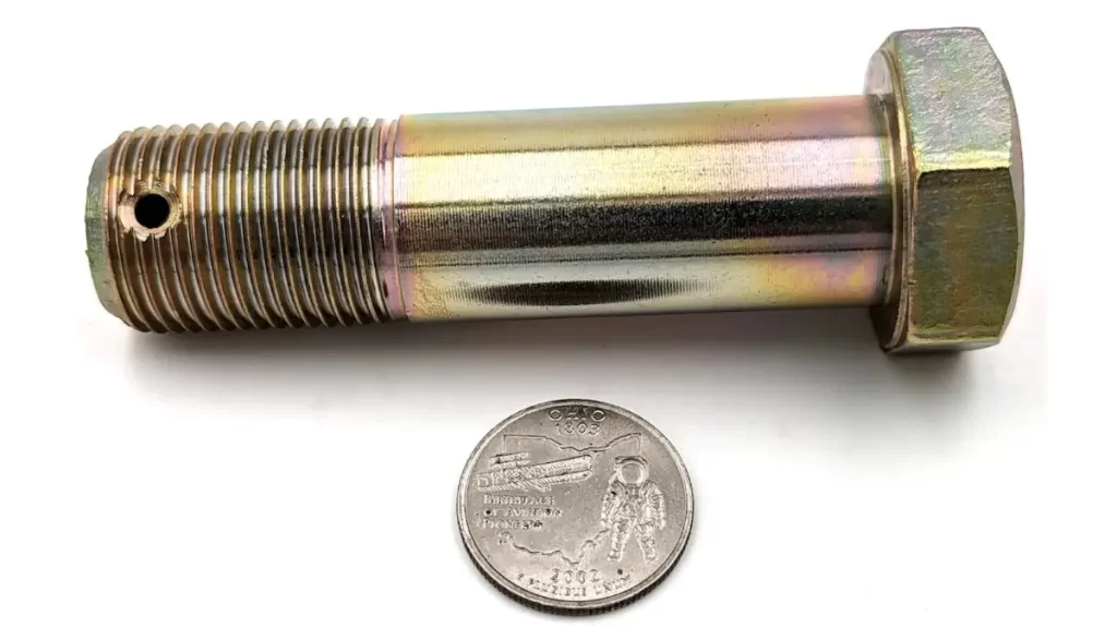 A close-up shot showing the detailed design of an aircraft bolt.