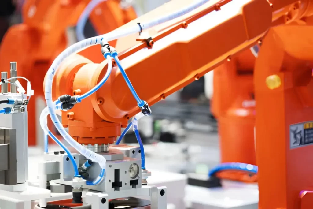 A Close-up of a robotic arm in operation. It highlights its moving joints and mechanical parts.