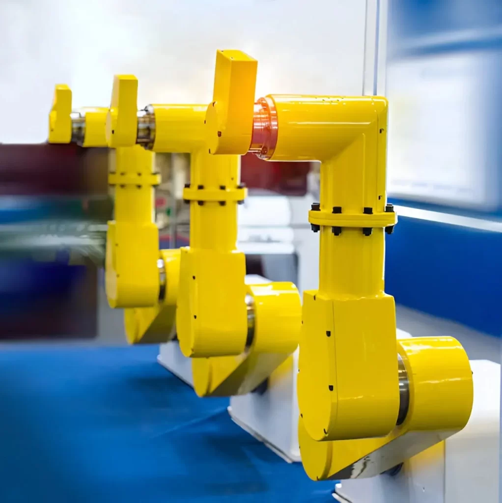 Three SCARA robots are displayed in a row, showing their compact design.
