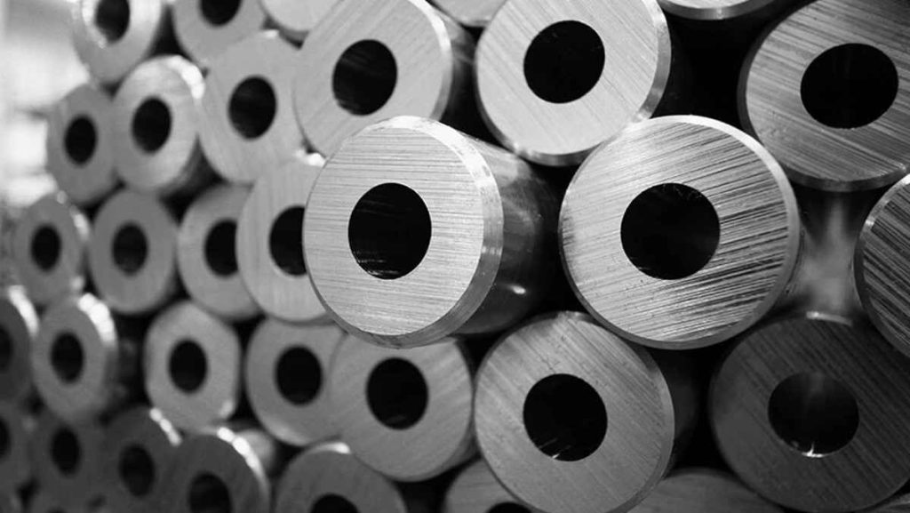 Stack of metal cylinders with central holes.