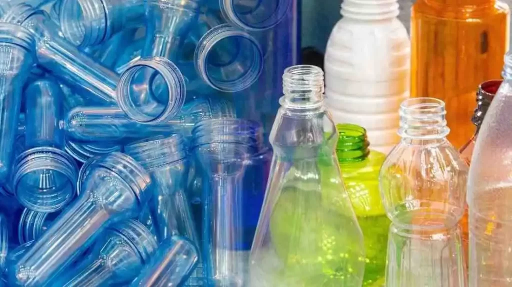 An assortment of colorful plastic bottles and preforms