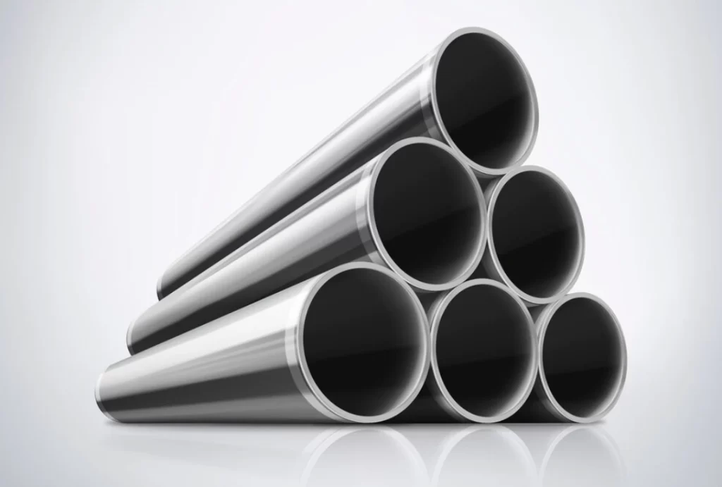 A closeup of six hollow round bars of carbon steel on a reflective white surface 
